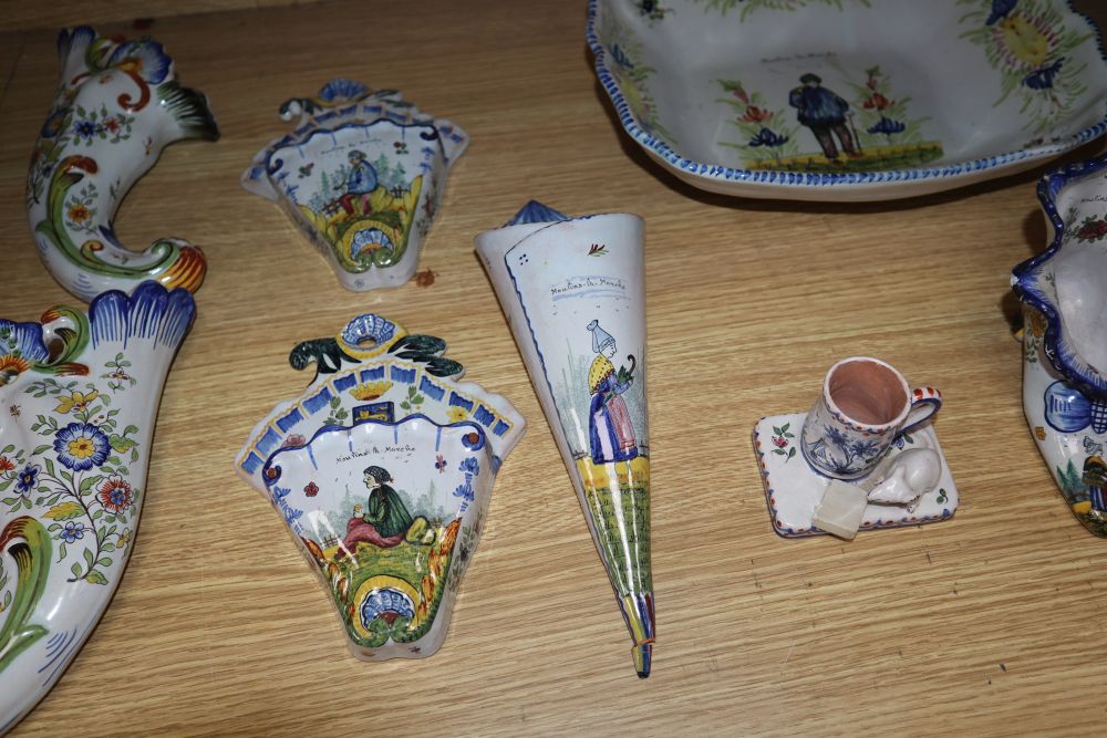 A group of Rouen faience wall pockets, a shoe, a mouse mug and a large dish, width 29cm